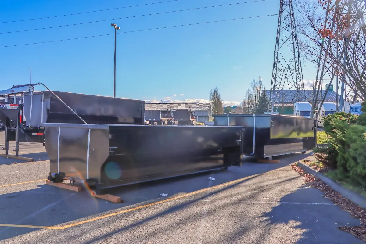 Roll-off dumpster ready for waste disposal at job site for Yard Waste Dumpster Rental in Rumford